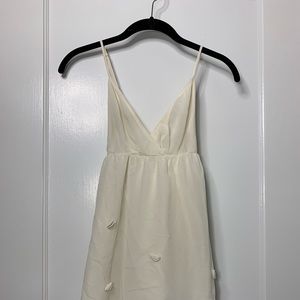 White dress with embroidered seashells